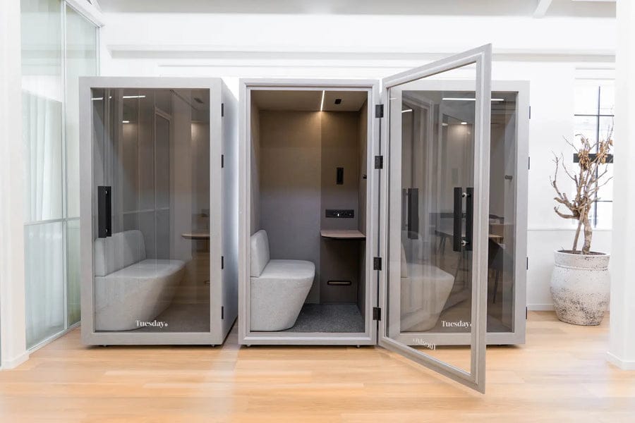 Three Bureau Tuesday pods in a light room, one with the door open