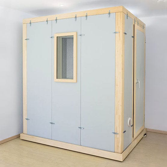 Studiobox audio booth installed in a room, front view with window and door