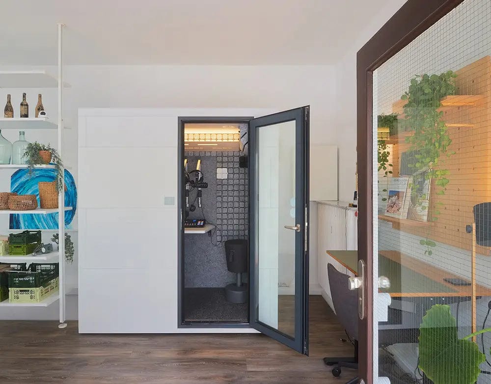 Studiobricks Podcast Duo booth in a home office with the door open